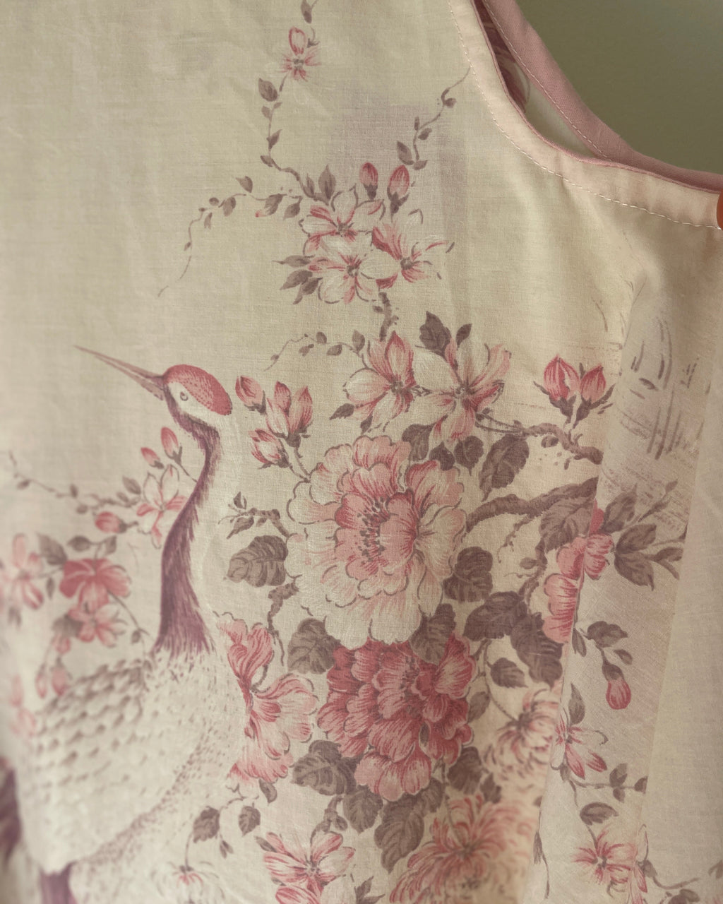 Floral and bird pattern on a fabric swatch