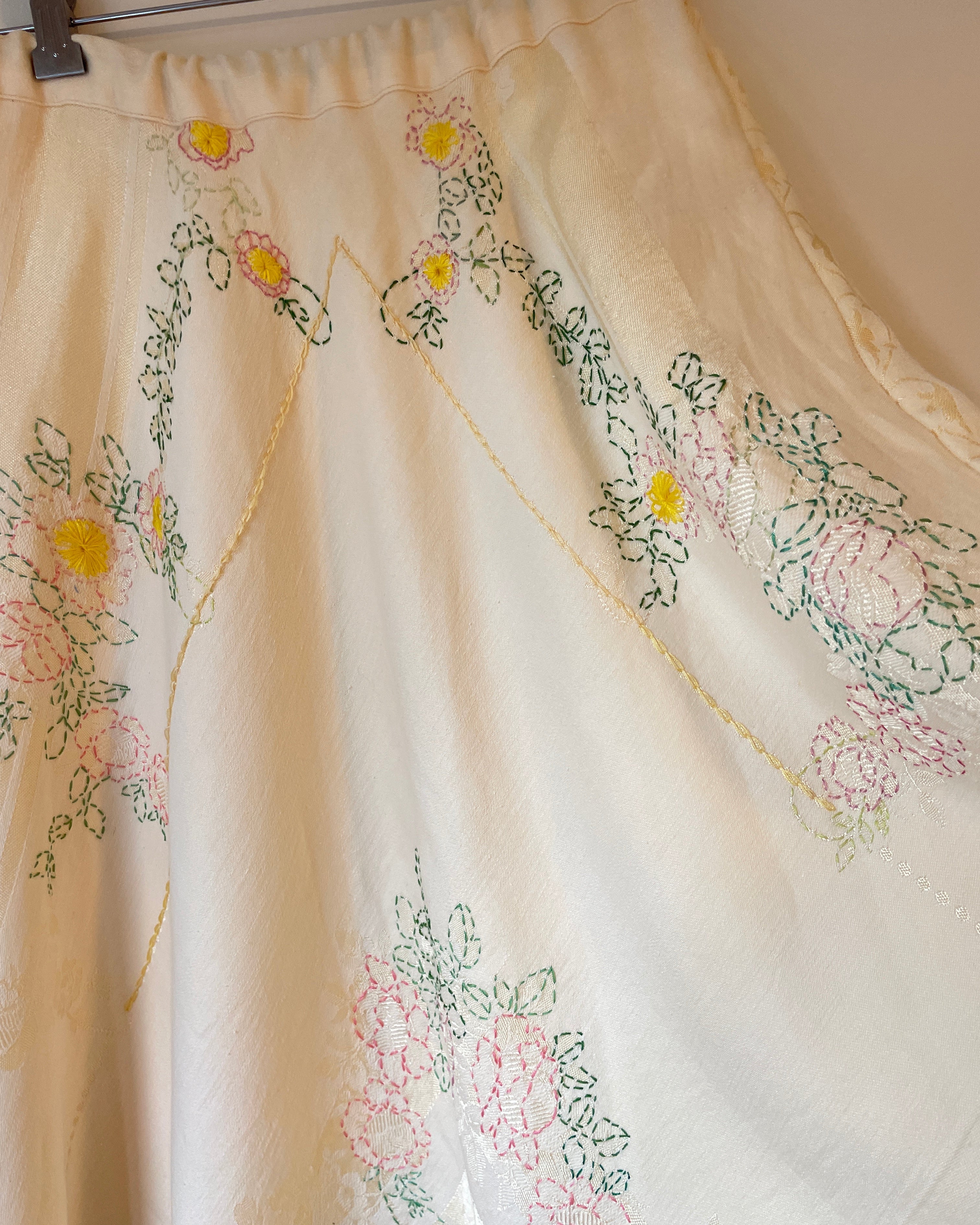 Embroidered skirt with floral patterns on a beige background