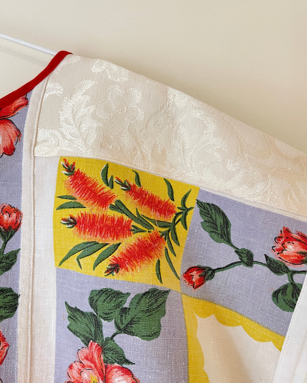 Floral and leaf patterned fabric on a white background
