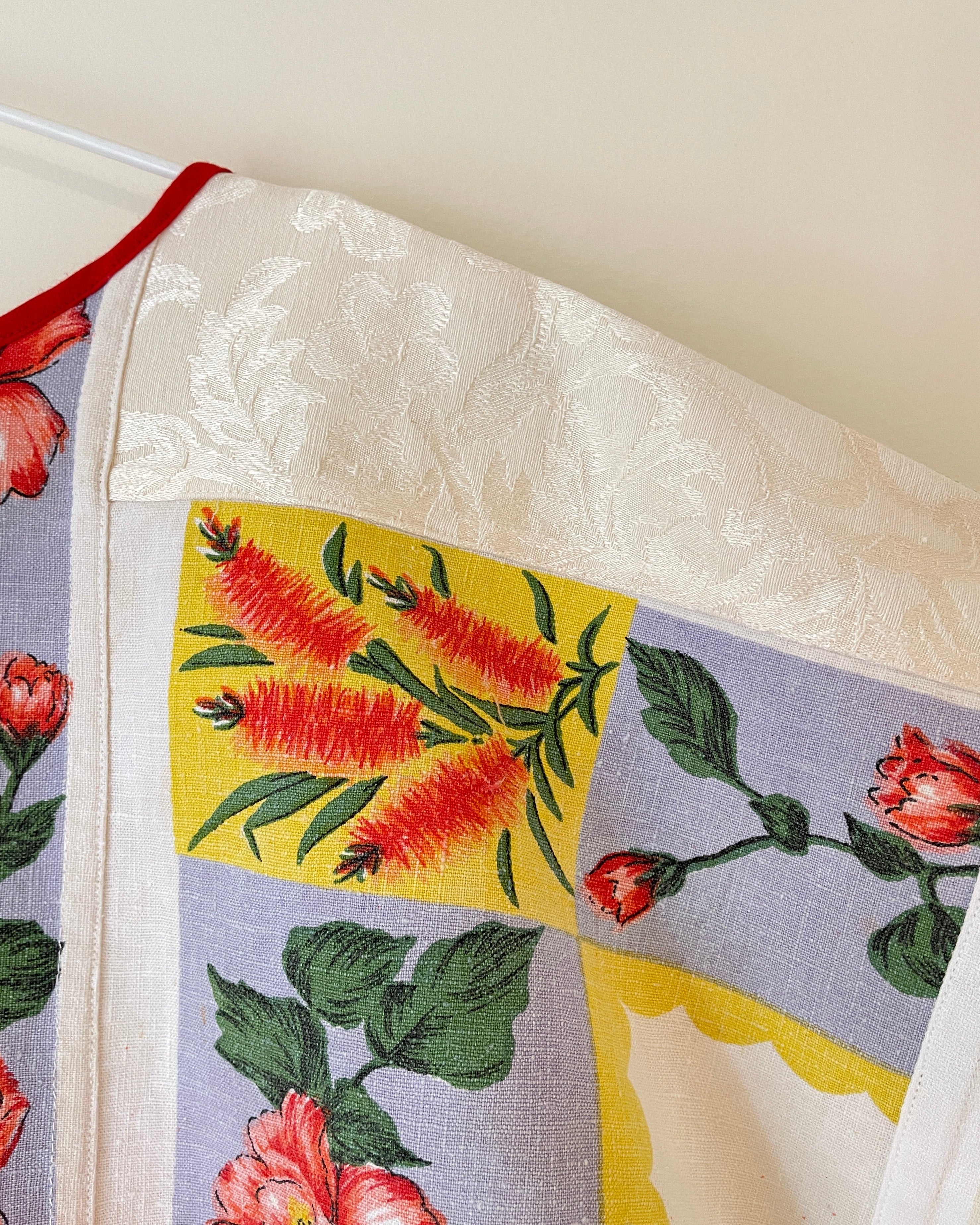 Floral and leaf patterned fabric on a white background