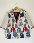 Jacket with animal-themed design on a hanger against a white background