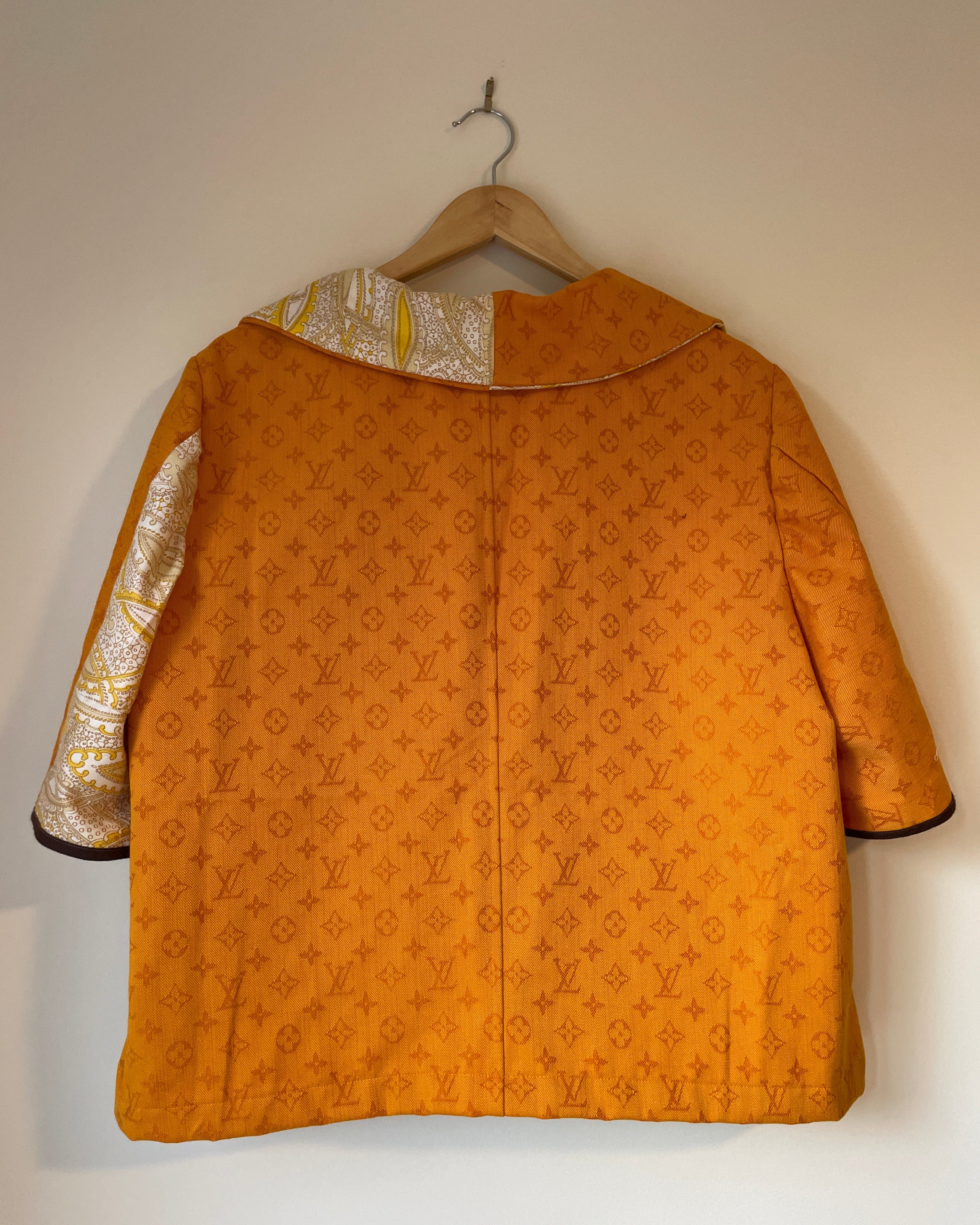 Gold patterned garment on a white background