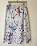 Skirt with bird and floral pattern on a beige background